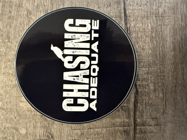 Chasing Adequate round sticker